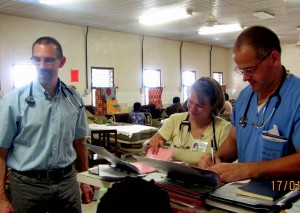 Visiting FP (Dr. Oram), Melissa Friesen (NP), and Fred at work in maternity