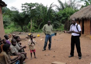 Pastor Jeremie sharing the gospel with family