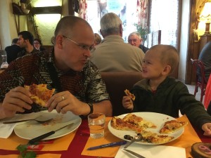 enjoying pizza at a local restaurant